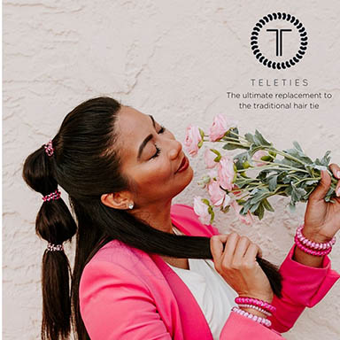 Photo of a woman using a Teletie in her hair